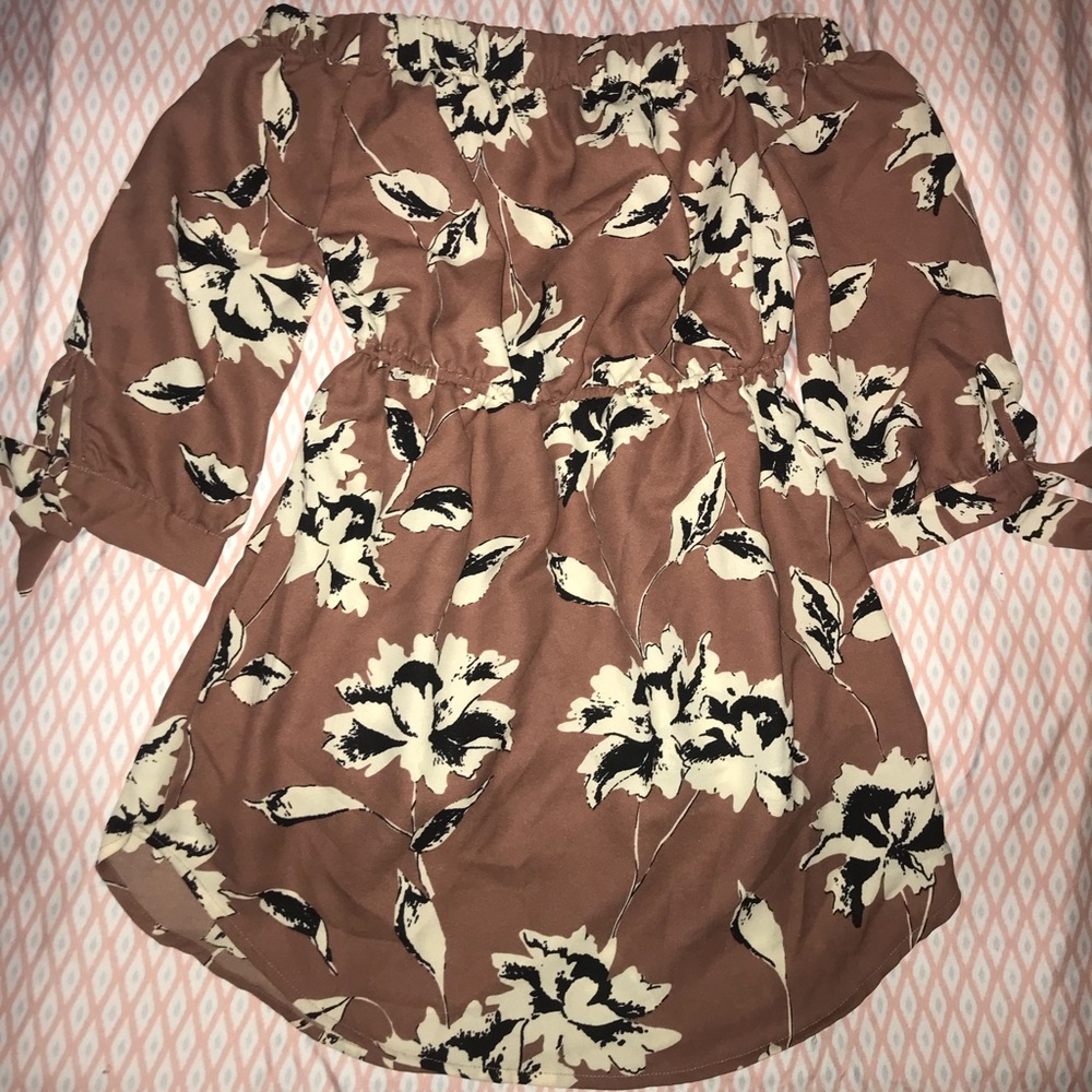 Blush colored off tge shoulder dress